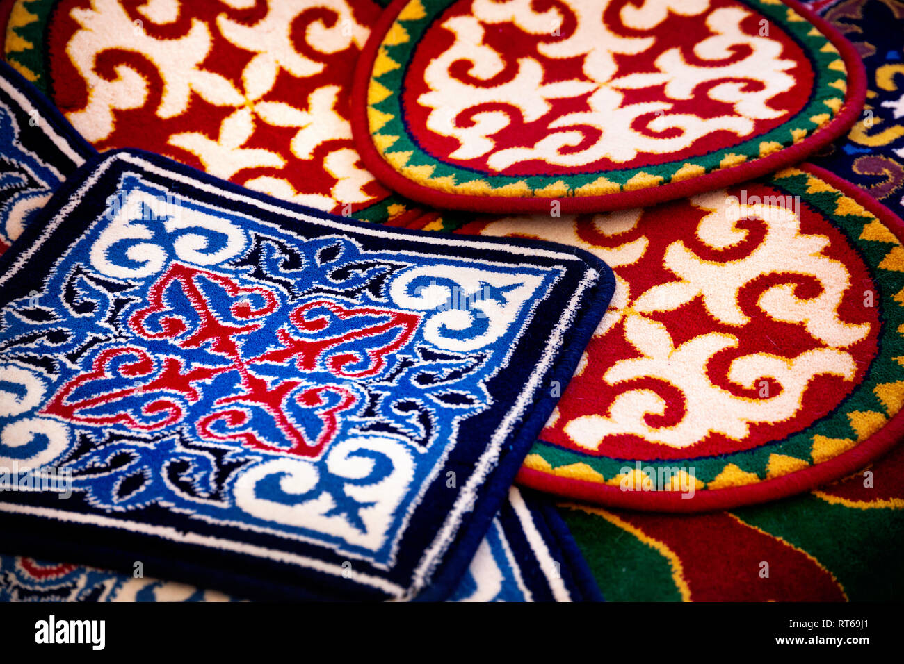 Ethnic oriental carpet with pattern in yurt at Asian market Stock Photo
