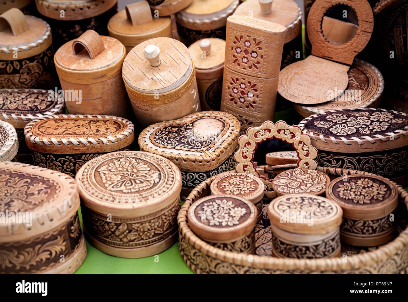 Ethnic wooden carved utensil and souvenirs in the market at Nauryz celebration in Almaty, Kazakhstan Stock Photo