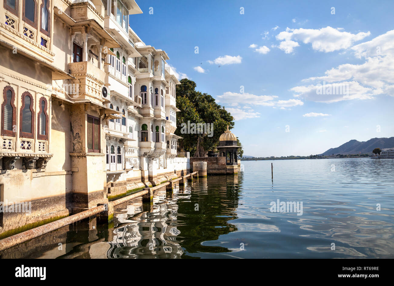 Lake Pichola with residential houses at cloudy sky in Udaipur, Rajasthan, India Stock Photo