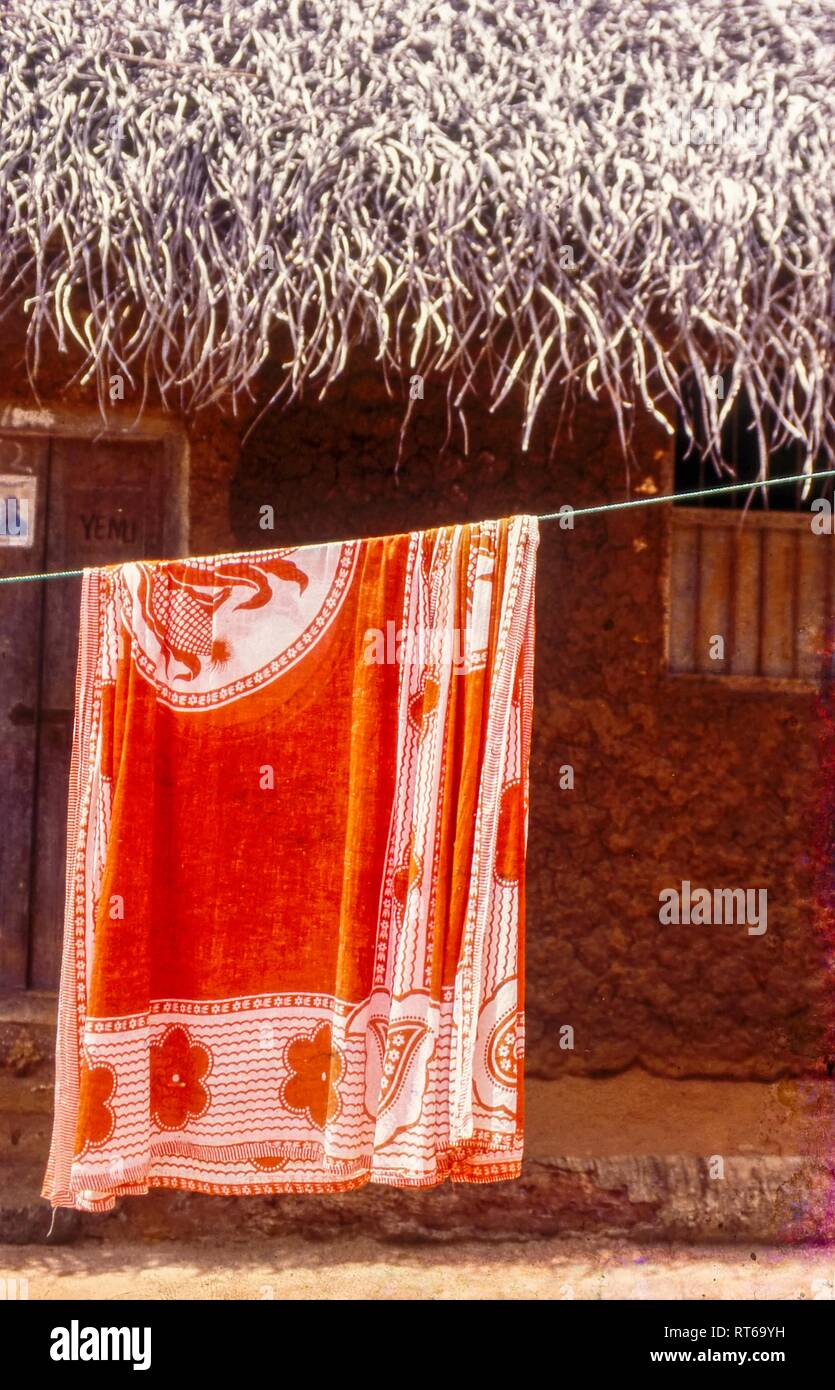illage life. Khanga hanging on a washing line to dry, Changani Village, Zanzibar, Tanzania Stock Photo