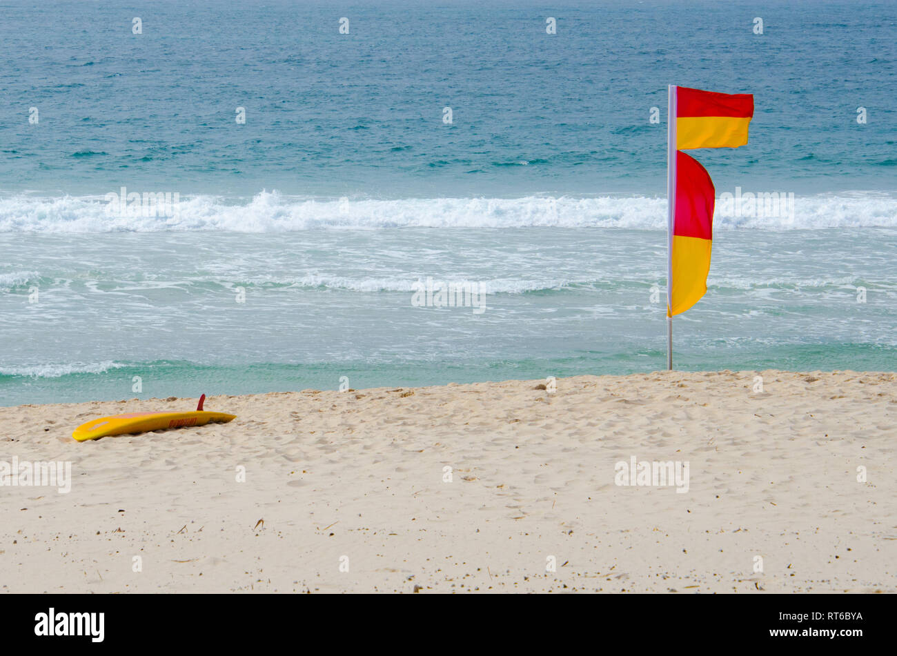 Summer safety between the surf lifesavers flags on Australian beaches. Stock Photo