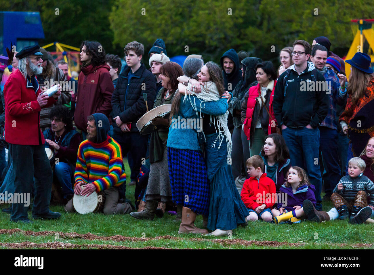 Two ladies hugging at the Beltane Fire Festival, Sussex, UK Stock Photo