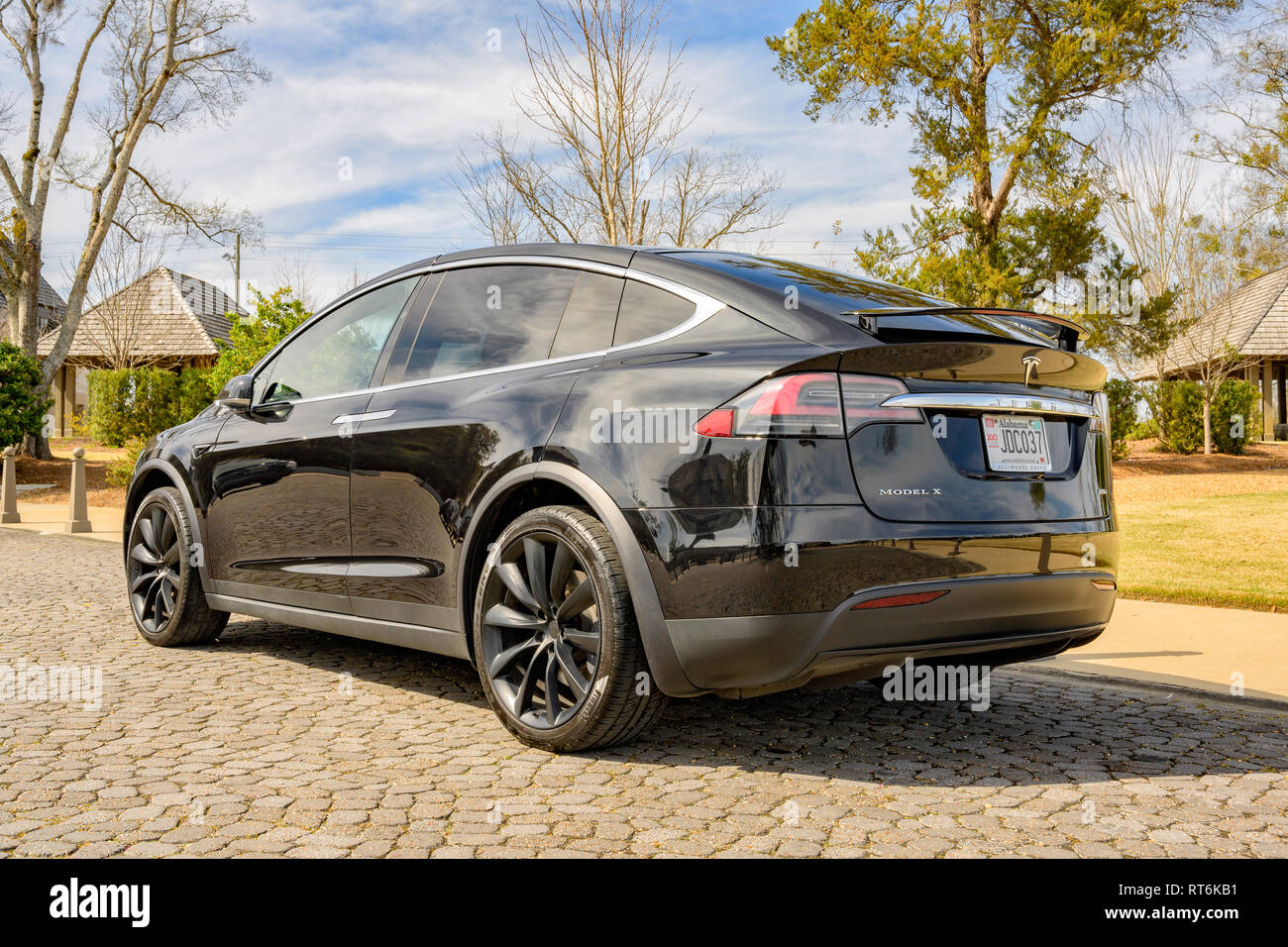Black Tesla Model X electric car parked on a city street in Montgomery Alabama, USA. Stock Photo