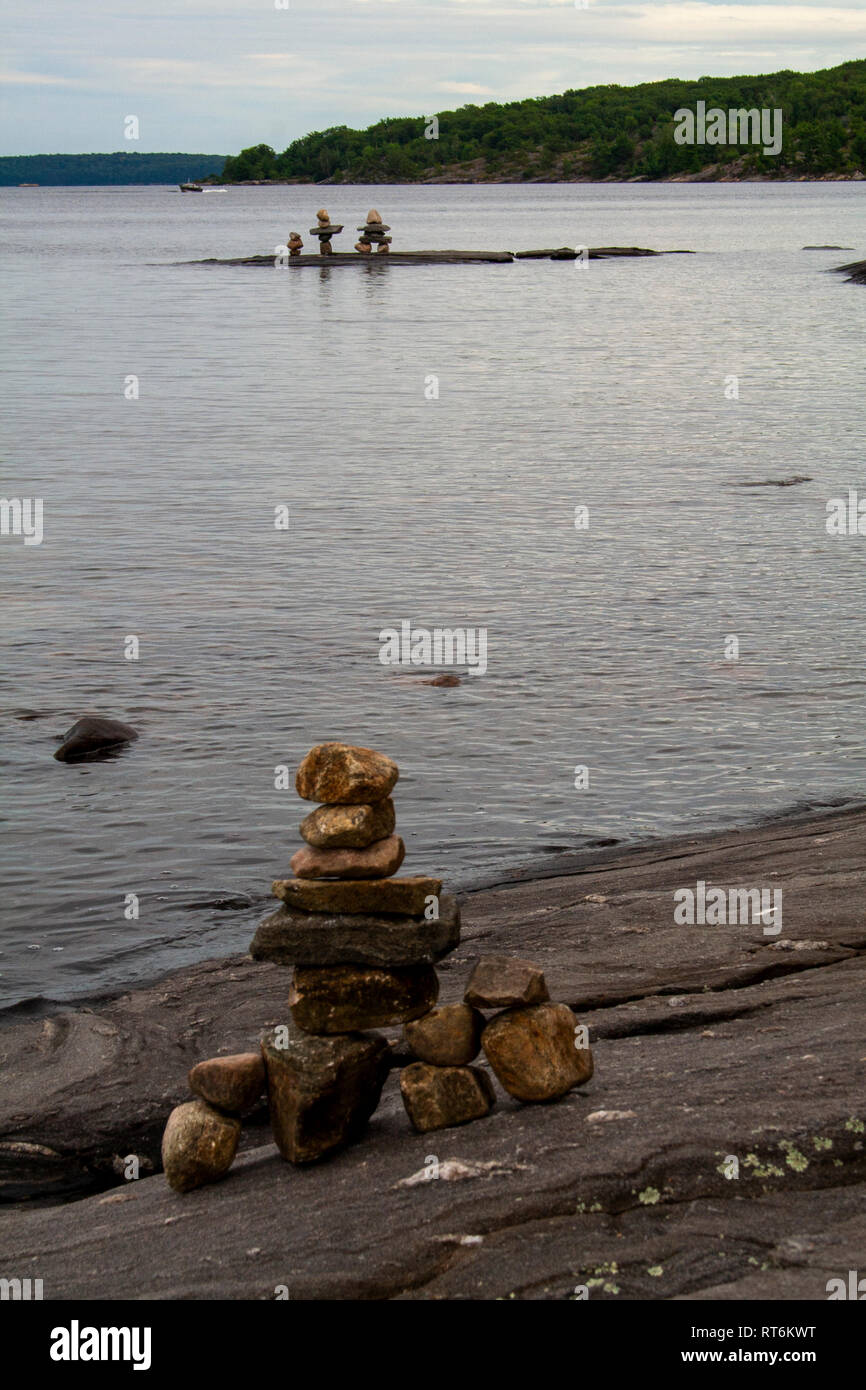 Inuit stone figures in Huron Lake, Ontario Stock Photo