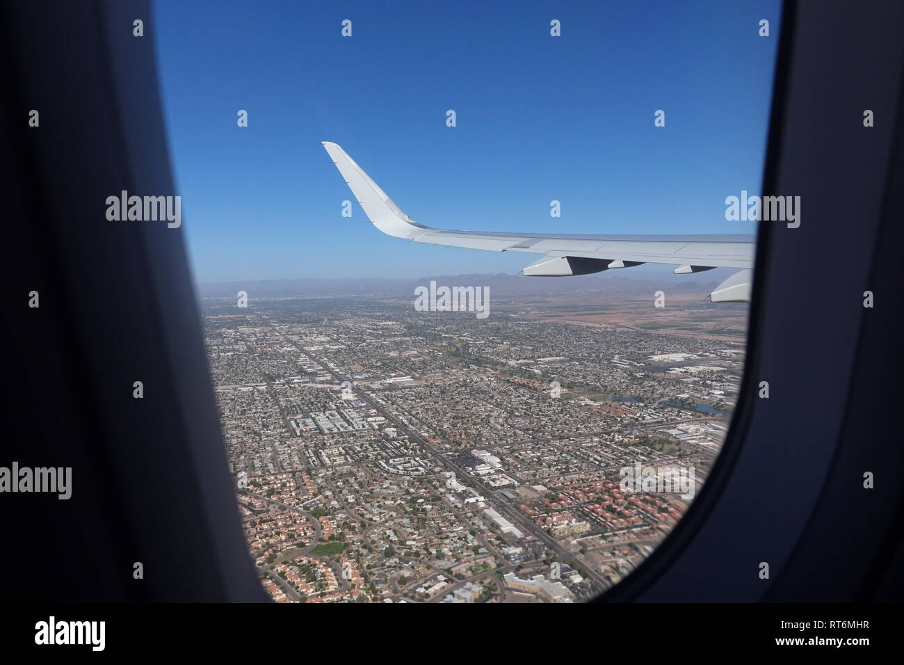 A view from 10,000 feet looking out the window of an airplane Stock