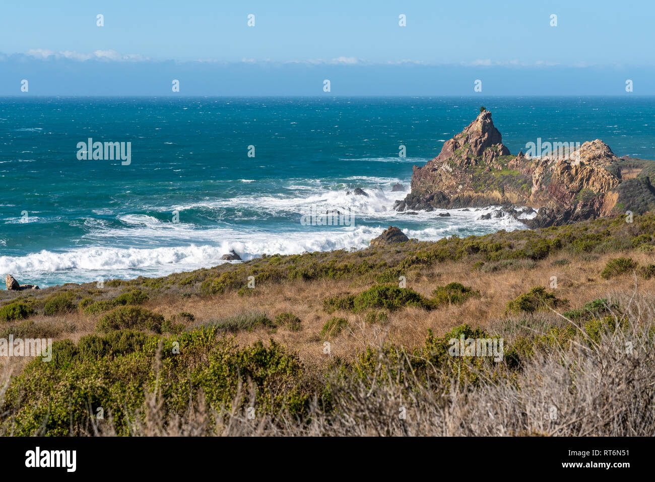 Waves crash onshore along the Highway One and California's Big Sur coastline. Stock Photo