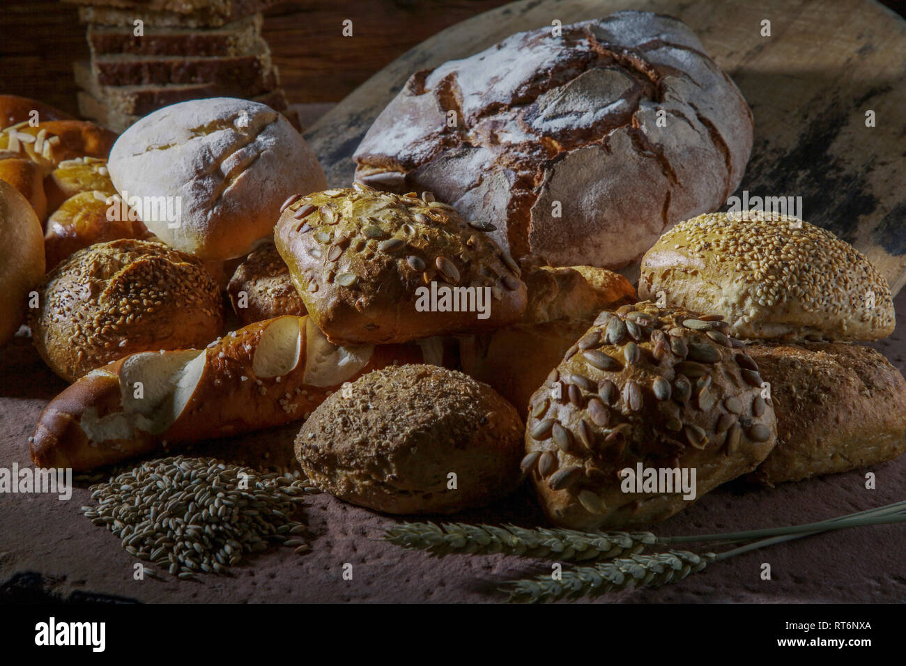 different types of bread on stone background Stock Photo
