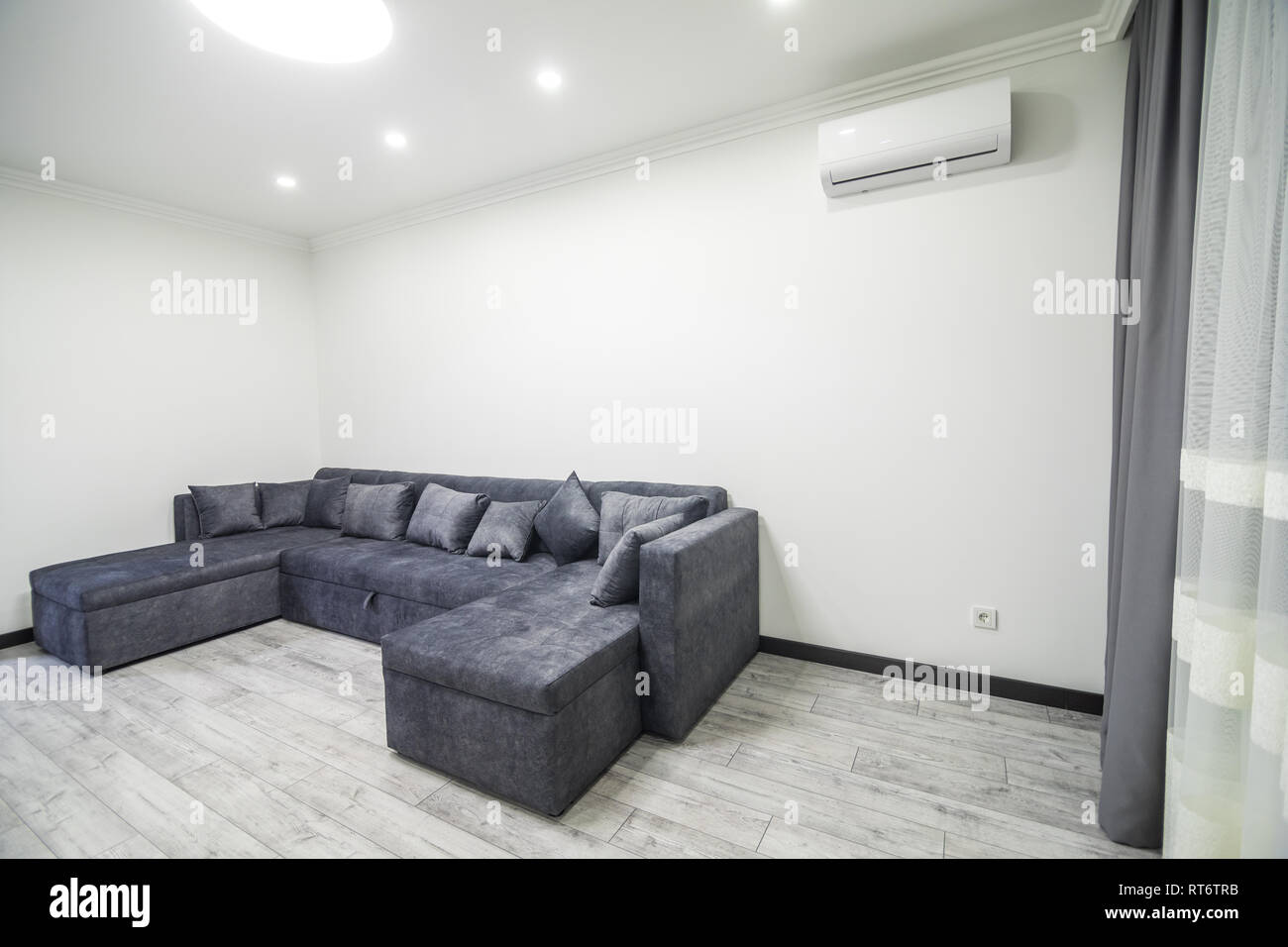 Beautiful living room with sofa. Minimalist disign Stock Photo