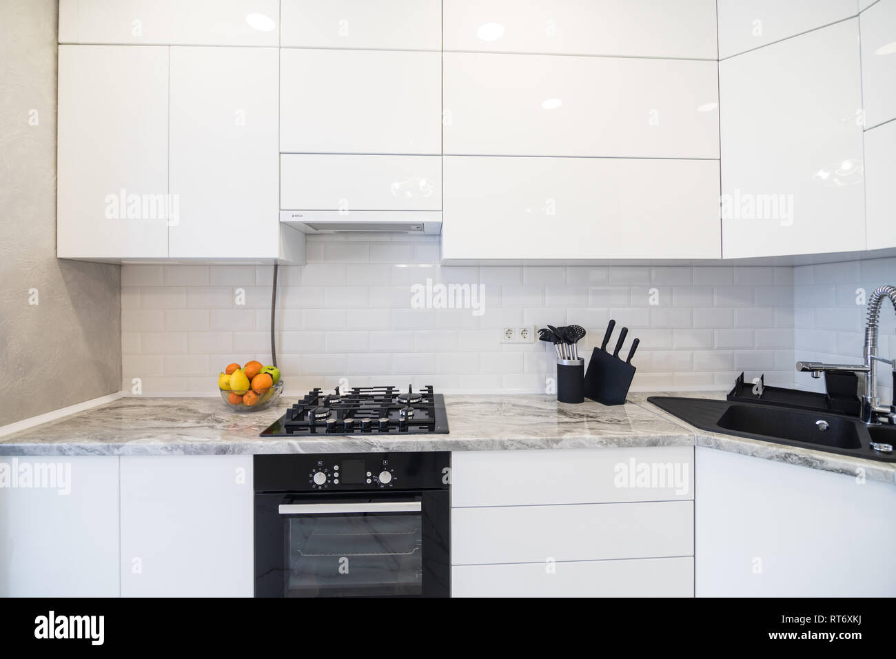 New modern kitchen interior. White monomalist kitchen disign. Stock Photo