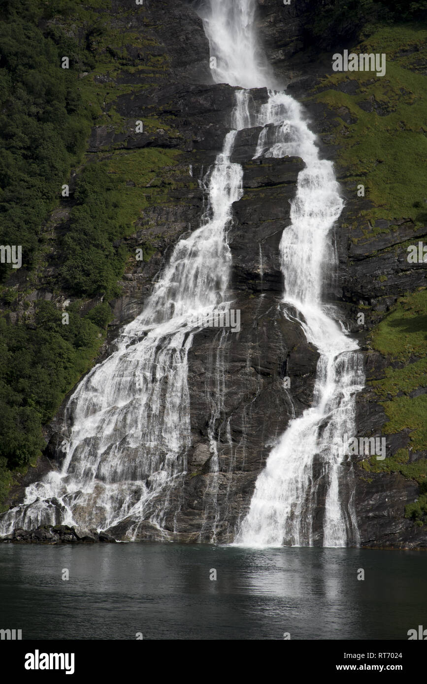 The Friar Waterfall faces the Seven Sisters waterfall just on the opposite site of Geirangerfjorden, which is a touristic hotspot in Norway. Stock Photo