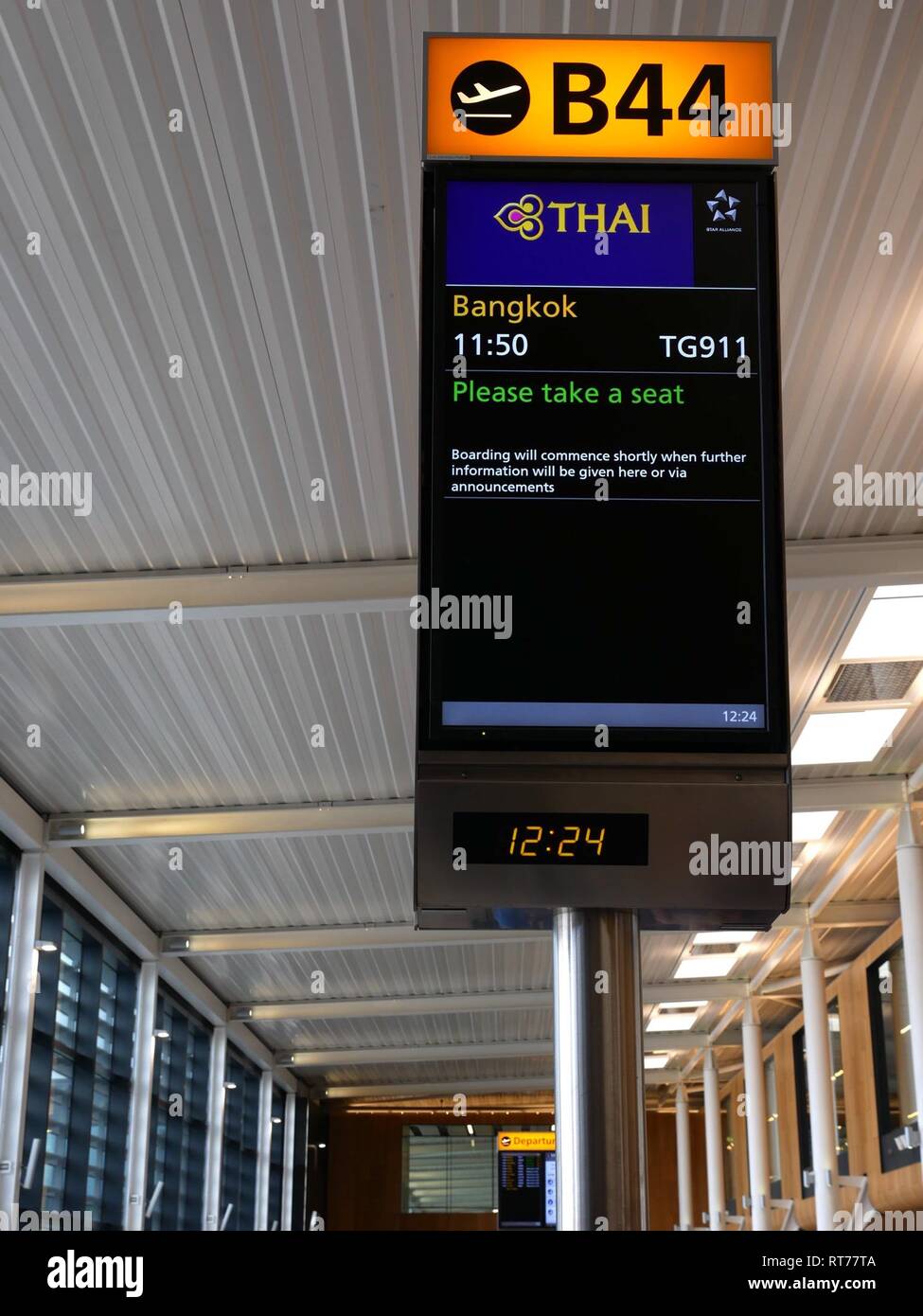 Terminal 2, Heathrow Airport, London, United Kingdom, 28th February 2019. After cancelling all flights between Bangkok and Heathrow yesterday due to the escalation of military tension between Pakistan and India and the closure of Pakistani airspace, Thai Airways flights are rerouted to fly over Chinese airspace. The backlog of passengers caused significant delays. The 11.50am flight from London to Bangkok was delayed until after 14.00 to cope with the backlog of passengers. The journey time was 2 hours longer and hundreds of passengers missed onward connections Stock Photo