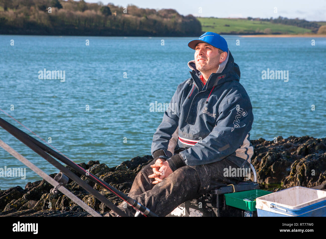 Fountainstown, Cork, Ireland. 28th Feb, 2019. With unseasonal warm weather where tempertures reached 13 degrees, Barry O' Rourke from Carrigaline takes the opportunity spend his spare time fishing from the rocks in Fountainstown, Co. Cork, Ireland Credit: David Creedon/Alamy Live News Stock Photo