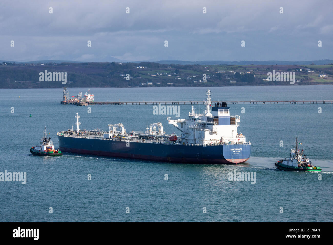 Whitegate, Cork, Ireland. 28th Feb, 2019. Port of Cork tug Alex assist the 250 meter oil tanker Searanger as she makes her way to a berth at the Whitegate Oil Refinery in Co. Cork, Ireland. Credit: David Creedon/Alamy Live News Stock Photo