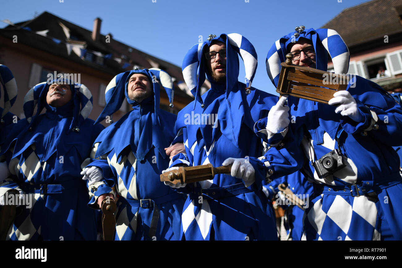 Staufen, Germany. 28th Feb, 2019. Staufener 'Schelme' are standing during the 'storm' on the town hall in the city centre. At the start of the hot phase of this year's Swabian-Alemannic carnival, many towns and communities in Baden-Württemberg have taken over the regiment at the 'dirty Dunschtig'. Credit: Patrick Seeger/dpa/Alamy Live News Stock Photo