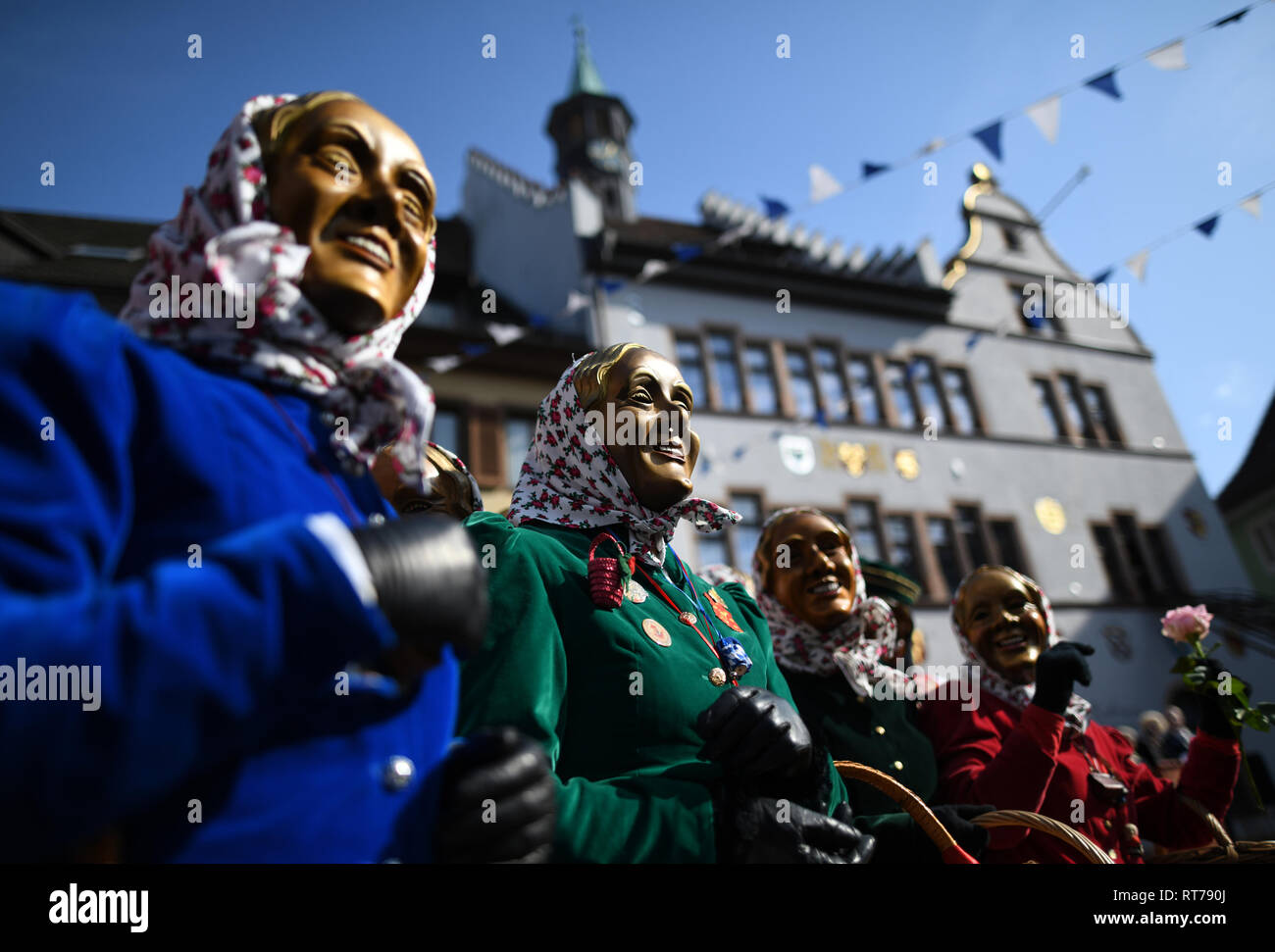 Staufen, Germany. 28th Feb, 2019. Staufener 'Schnurrewiber' are standing during the 'storm' on the town hall in the city centre. At the start of the hot phase of this year's Swabian-Alemannic carnival, many towns and communities in Baden-Württemberg have taken over the regiment at the 'dirty Dunschtig'. Credit: Patrick Seeger/dpa/Alamy Live News Stock Photo