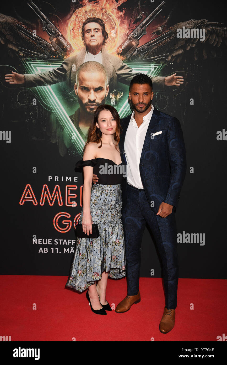 28 February 2019 Bavaria Munchen British actor Ricky Whittle and Australian actress Emily Browning are on the red carpet for the film American Gods Season 2 at Gloria Palace. The sequel