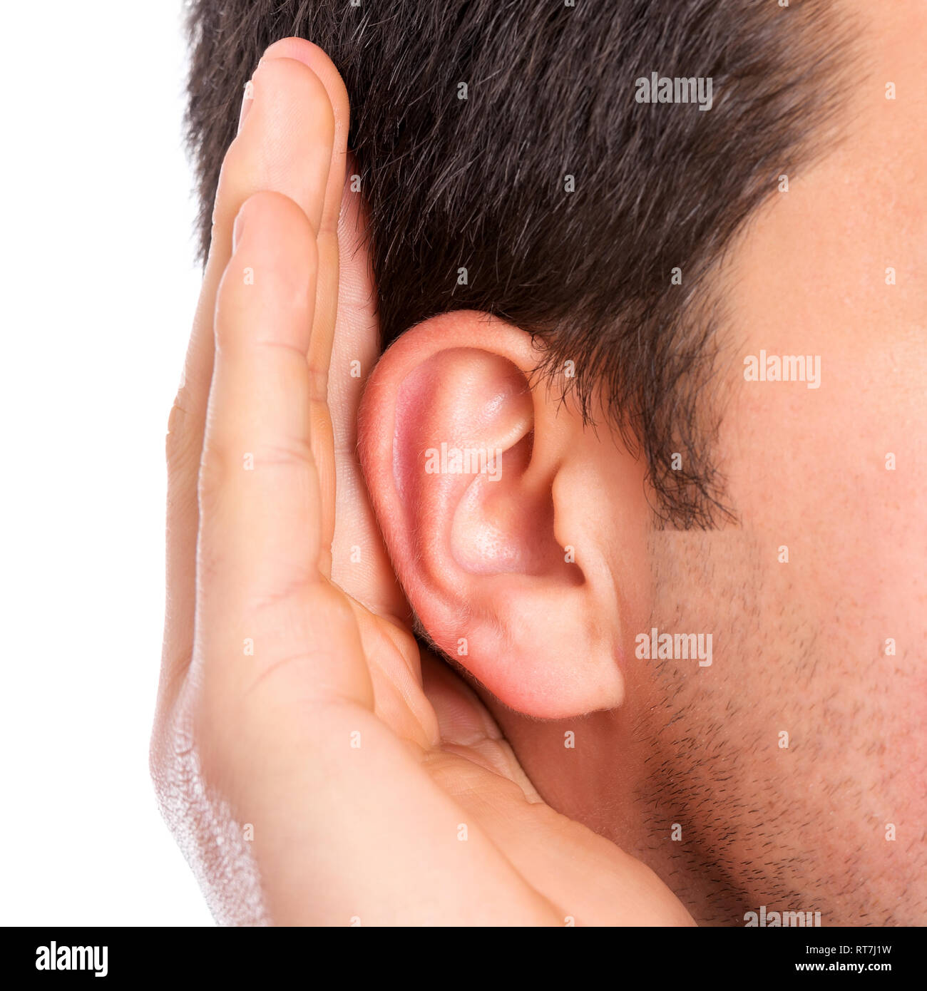 Hand on ear listening for quiet sound Stock Photo Alamy