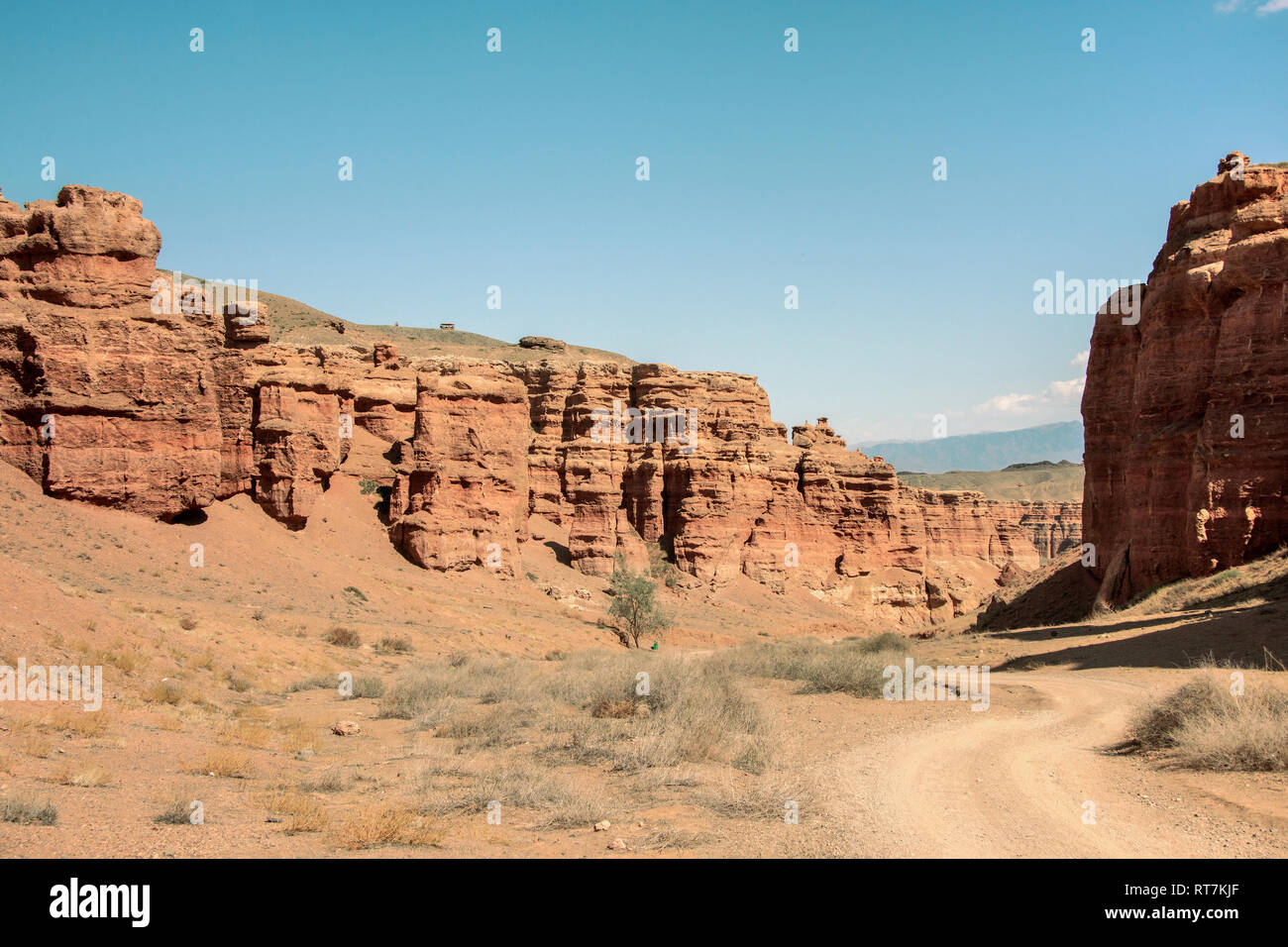 Dirt road down the Valley of Castles, Charyn Canyon, Kazakhstan Stock Photo
