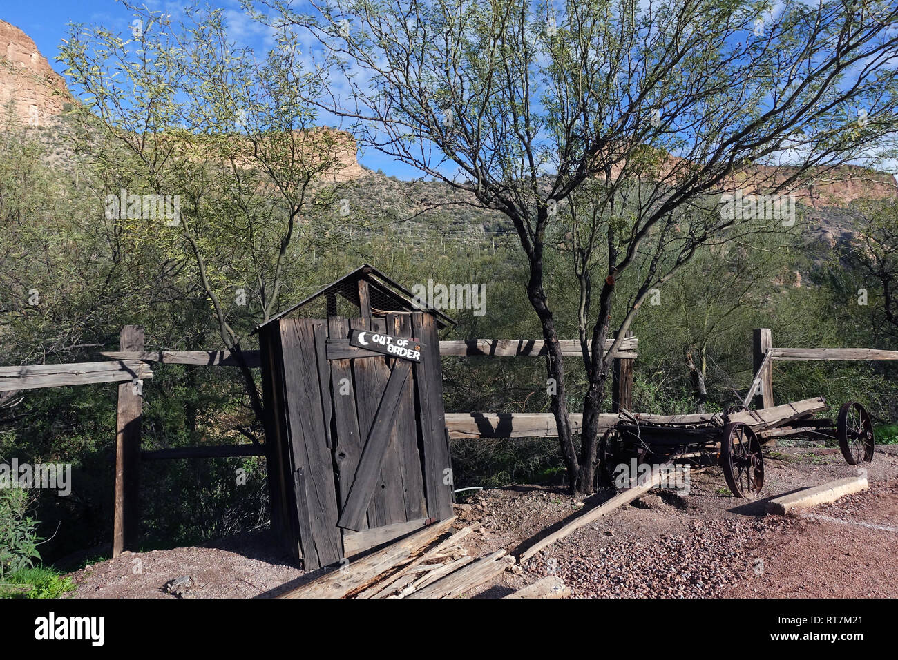 An outhouse, also known by many other names, is a small structure, separate from a main building, which covers a toilet. Stock Photo