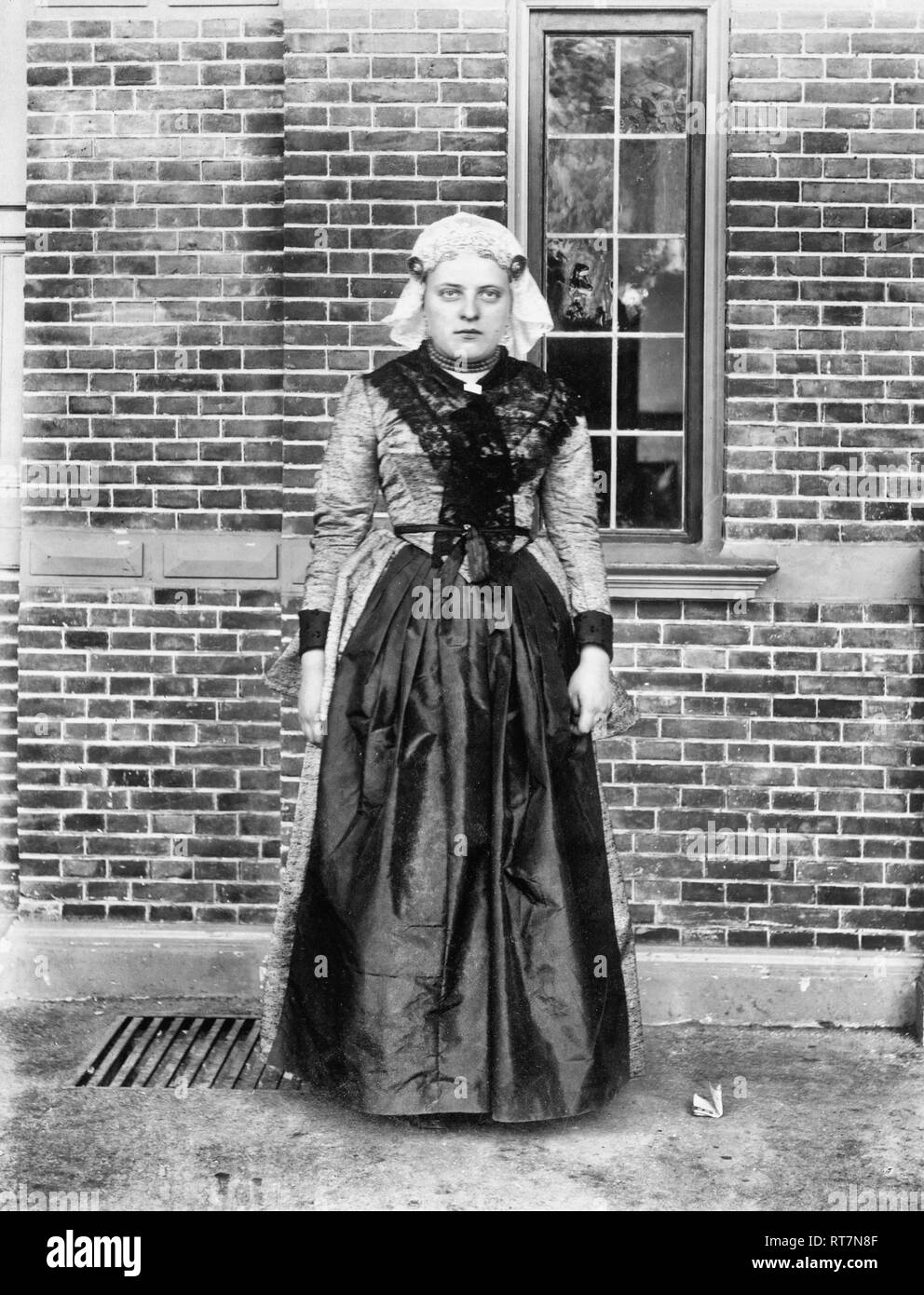 Woman in traditional Dutch dress in front of Cacao van Houten exhibit, Paris Exposition, 1889 Stock Photo