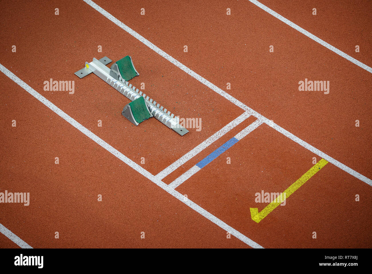 Starting blocks on track line on indoor arena top view Stock Photo Alamy