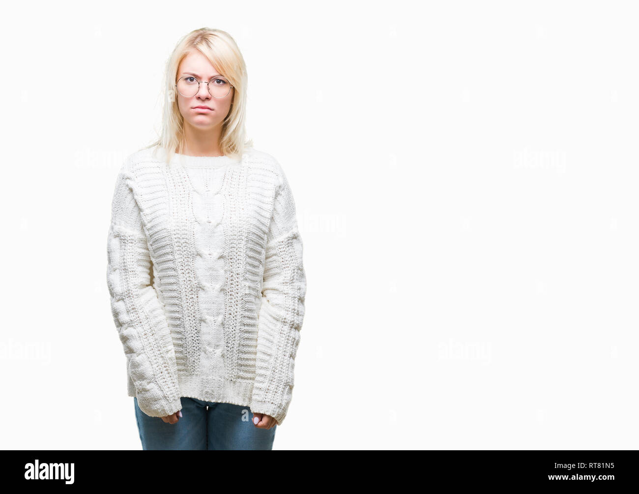 Young beautiful blonde woman wearing winter sweater and glasses over isolated background skeptic and nervous, frowning upset because of problem. Negat Stock Photo