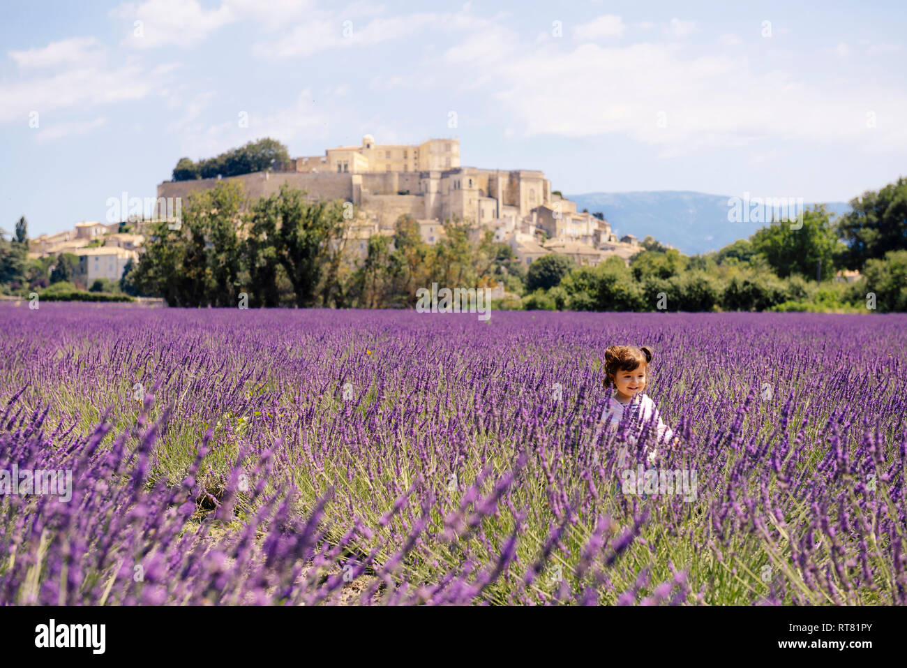 France, Grignan, happy baby girl in lavender field Stock Photo