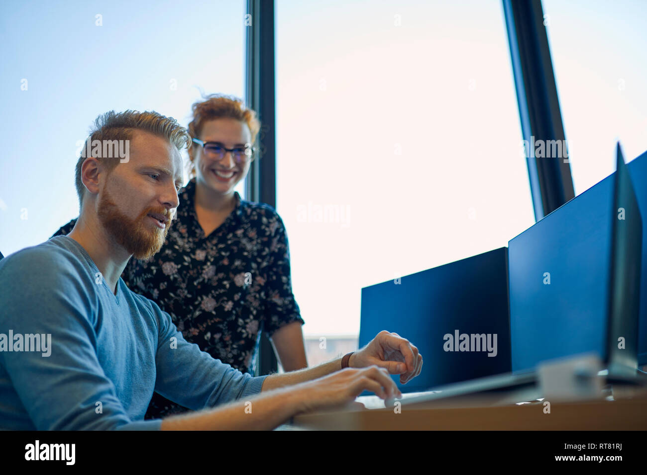 Two colleagues working together in office Stock Photo