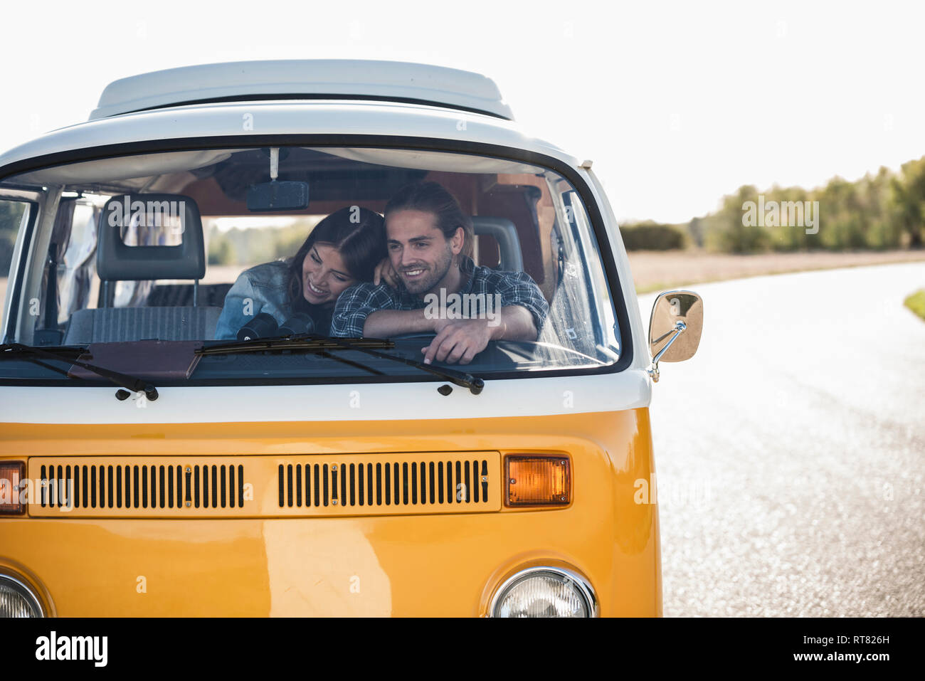 Affectionate couple doing a road trip in theit camper Stock Photo