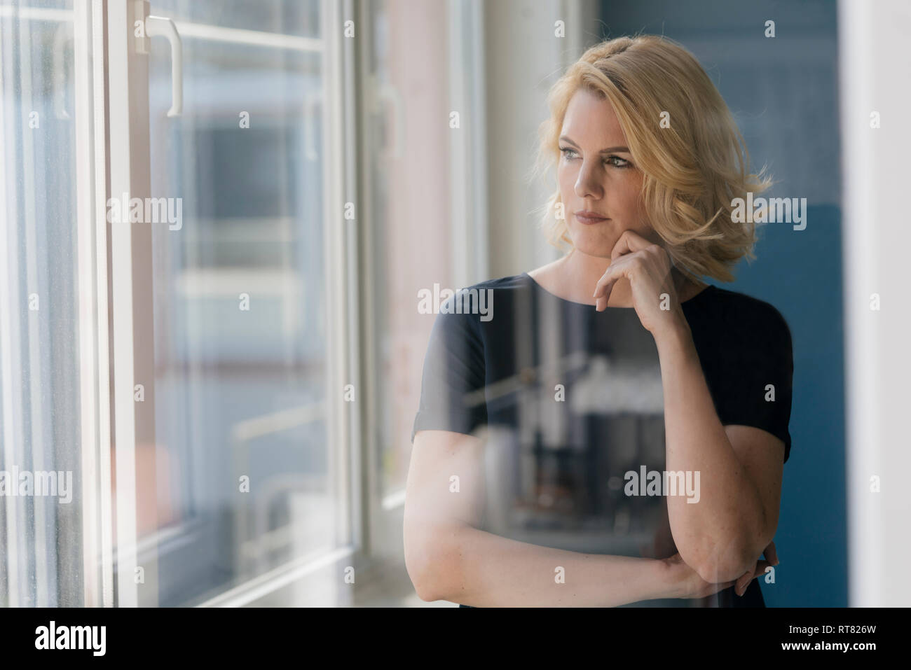 Serious blonde woman glasses hi-res stock photography and images - Alamy