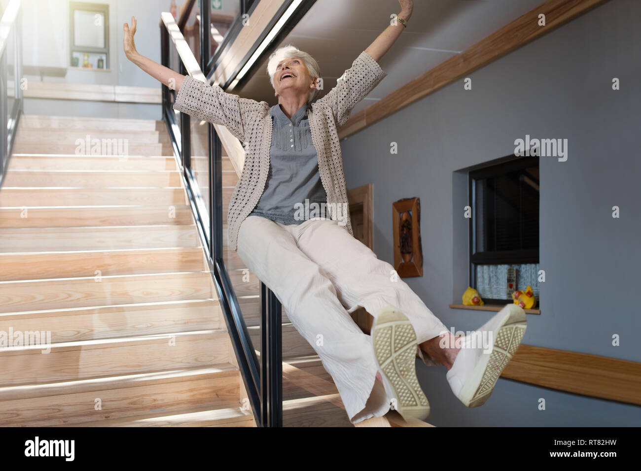Sliding down stairs hires stock photography and images Alamy