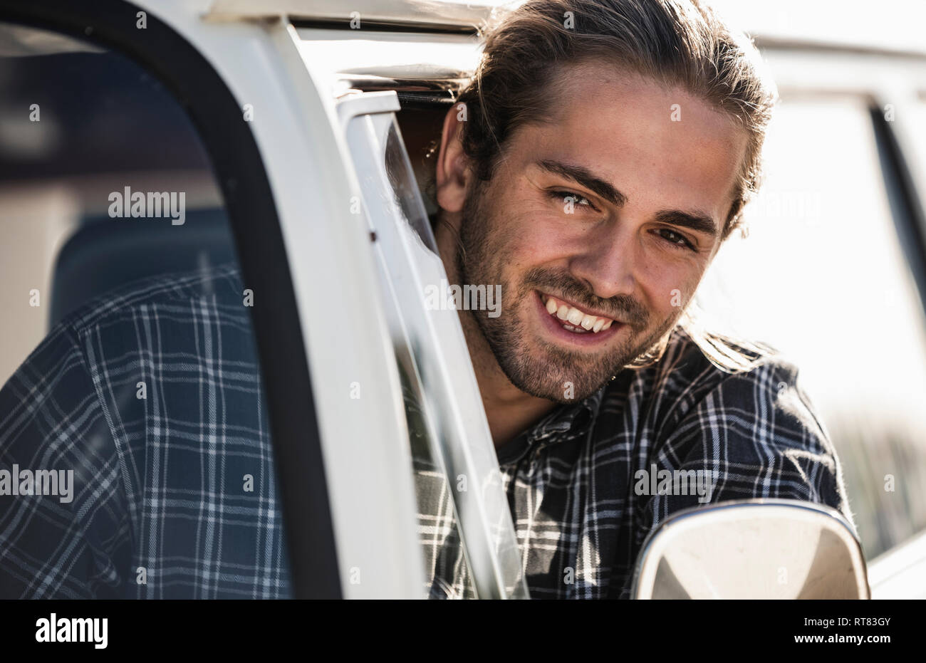 Young man on a road trip with his camper Stock Photo