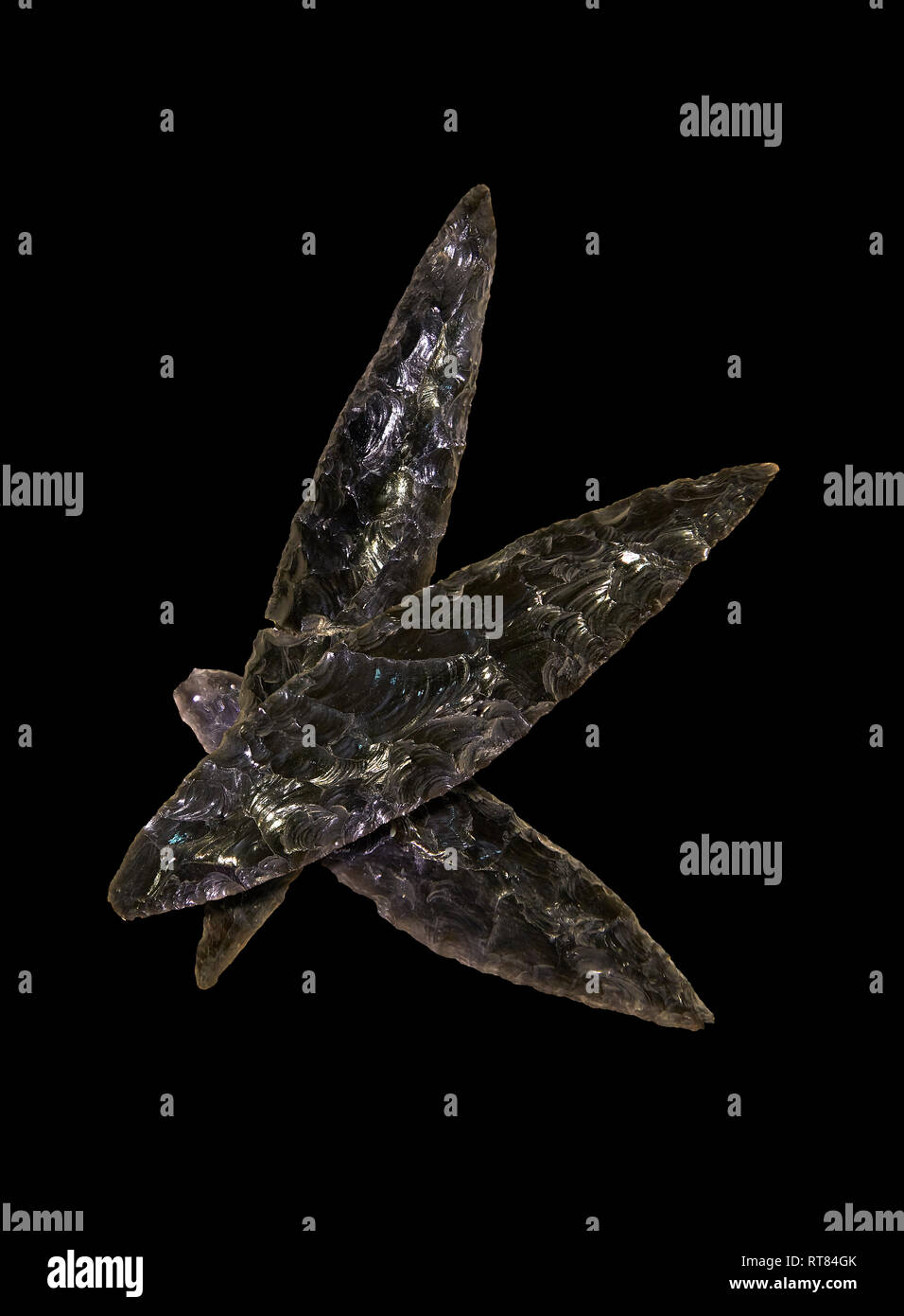 Black obsidian blades. Catalhoyuk Collections. Museum of Anatolian Civilisations, Ankara. Against a black background Stock Photo