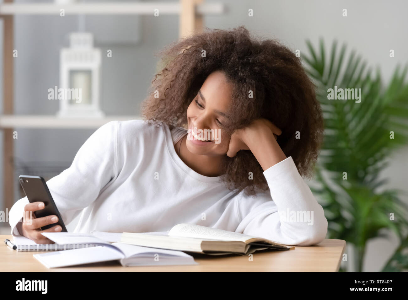 African schoolgirl instead studying using smartphone texting to friend ...