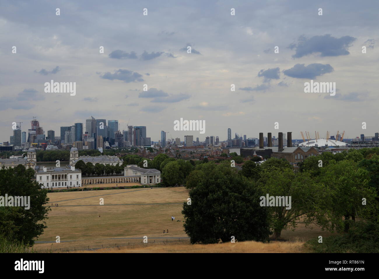 View over the city and architectural landmarks like the Old Royal Naval College and the O2 Arena from Greenwich in London, United Kingdom. Stock Photo
