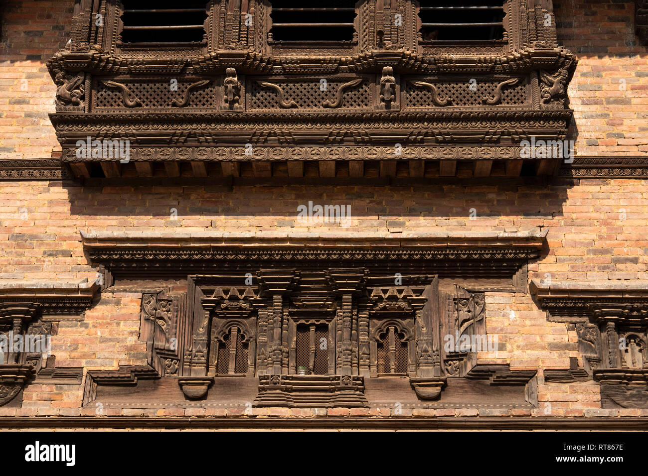 Nepal, Kathmandu Valley, Bhaktapur, Tachupal Tole, beautifully carved ancient wooden windows Stock Photo