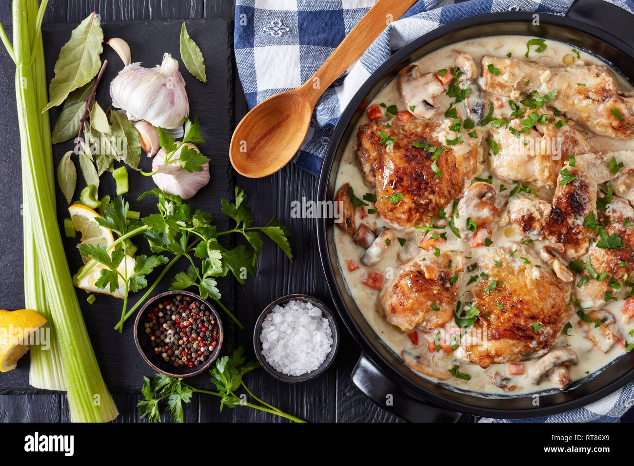 chicken fricassee in a black dutch oven chicken meat browned and braised in white wine creamy