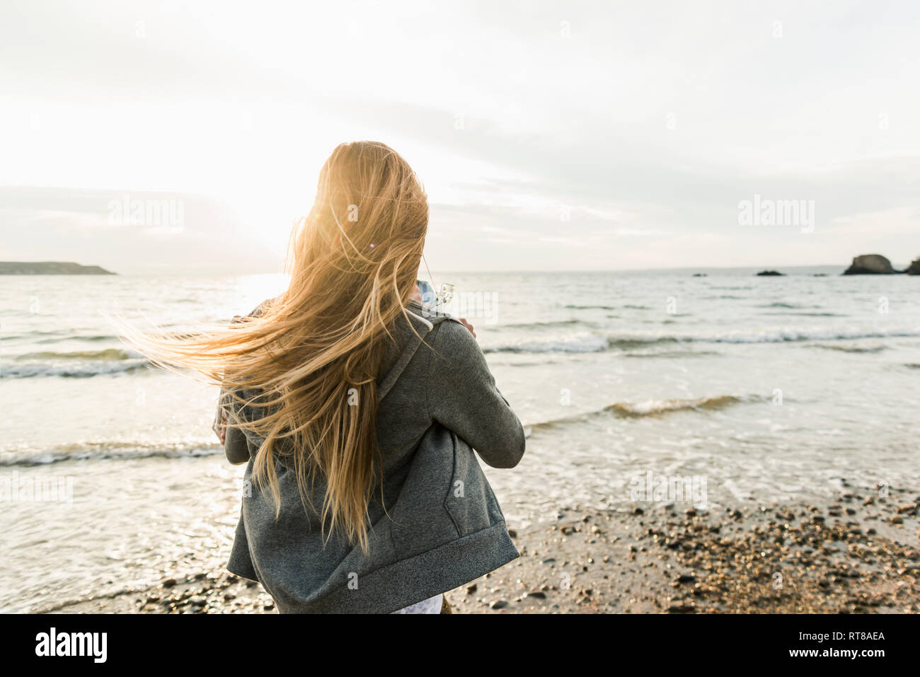 Young woman watching the sunset hi-res stock photography and images - Alamy