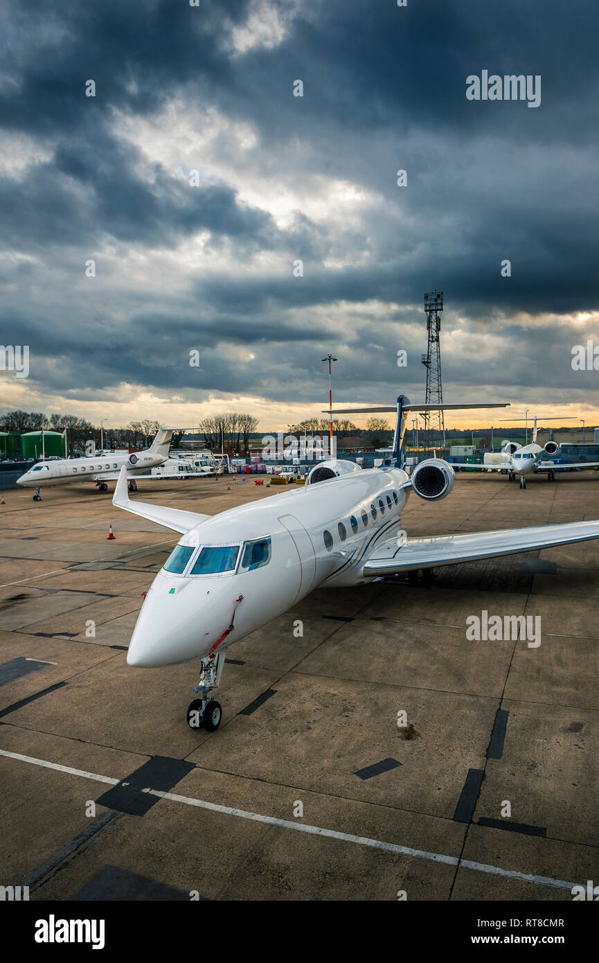 Business jet aircraft on the apron area of Luton airport, England. Stock Photo