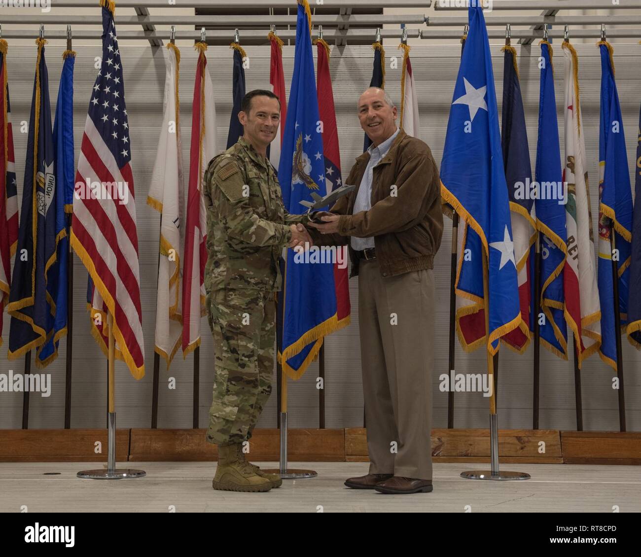 https://c8.alamy.com/comp/RT8CPD/mr-jerry-williams-an-outgoing-member-of-the-air-education-and-training-command-commanders-civic-leader-group-is-presented-with-a-token-of-appreciation-by-col-paul-moga-33rd-fighter-wing-commander-during-the-2018-annual-awards-ceremony-jan-25-2019-at-eglin-air-force-base-fla-williams-selflessly-devoted-his-time-and-resources-to-champion-the-needs-of-the-33rd-fw-at-the-major-command-level-and-provided-support-to-the-local-aetc-community-RT8CPD.jpg