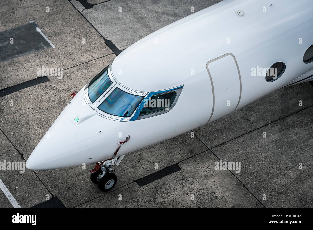 Front of a business jet aircraft at Luton airport, England. Stock Photo