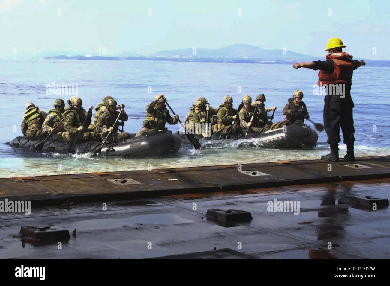 Marines with Alpha Company, Battalion Landing Team, 1st Battalion, 4th Marines, launch their Combat Rubber Raiding Crafts from the dock landing ship USS Ashland (LSD 48), Philippine Sea, Jan. 25, 2019. BLT 1/4 is the Ground Combat Element for the 31st Marine Expeditionary Unit. The 31st MEU, the Marine Corps’ only continuously forward-deployed MEU partnering with Wasp ARG, provides a flexible and lethal force ready to perform a wide range of military operations as the premier crisis response force in the Indo-Pacific region. Stock Photo