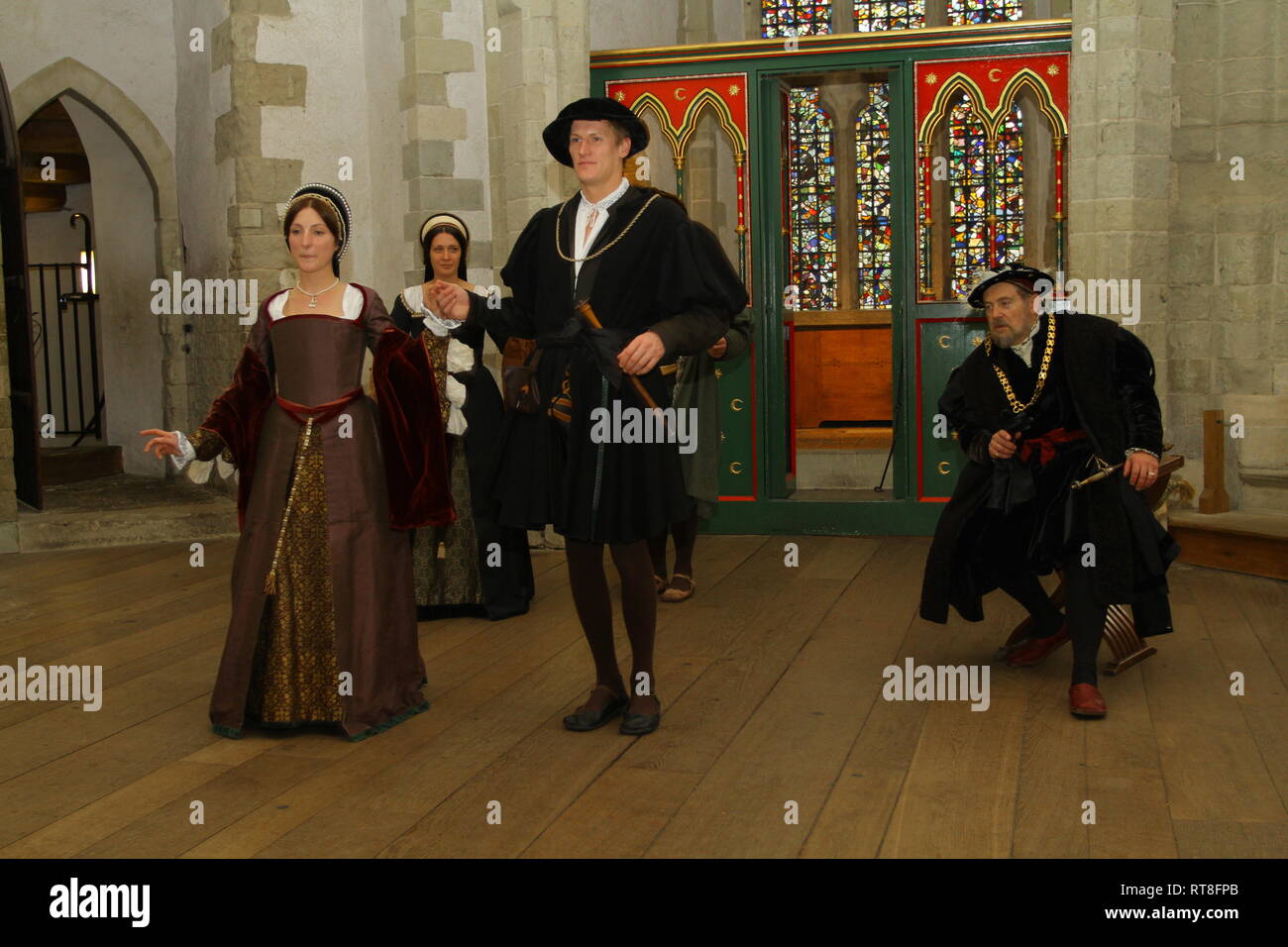 Anne Boleyn and Henry VIII are art a dance with courtiers at The Tower of London Stock Photo
