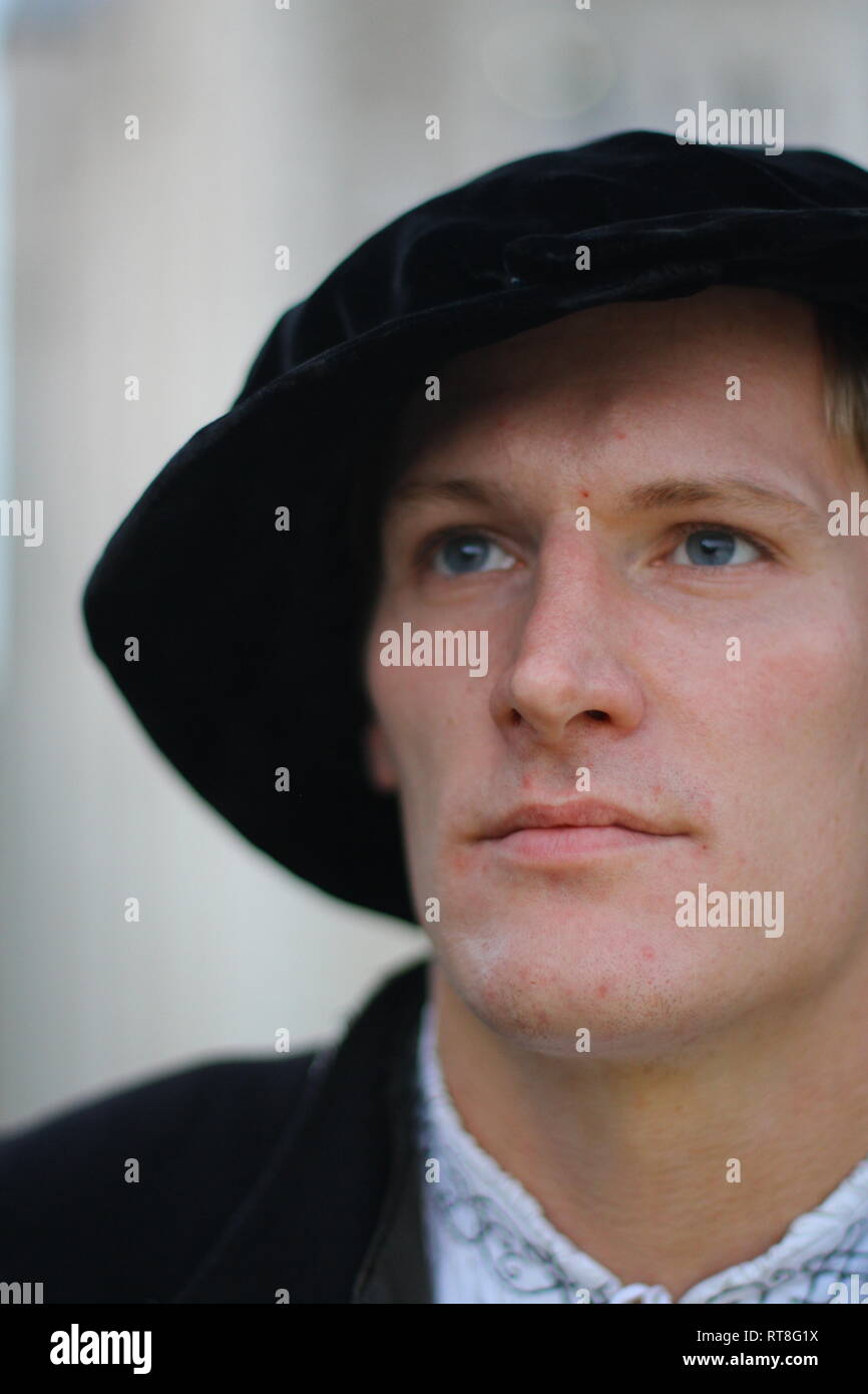 Portrait of a young Tudor man wearing authentic Tudor clothes poses ...