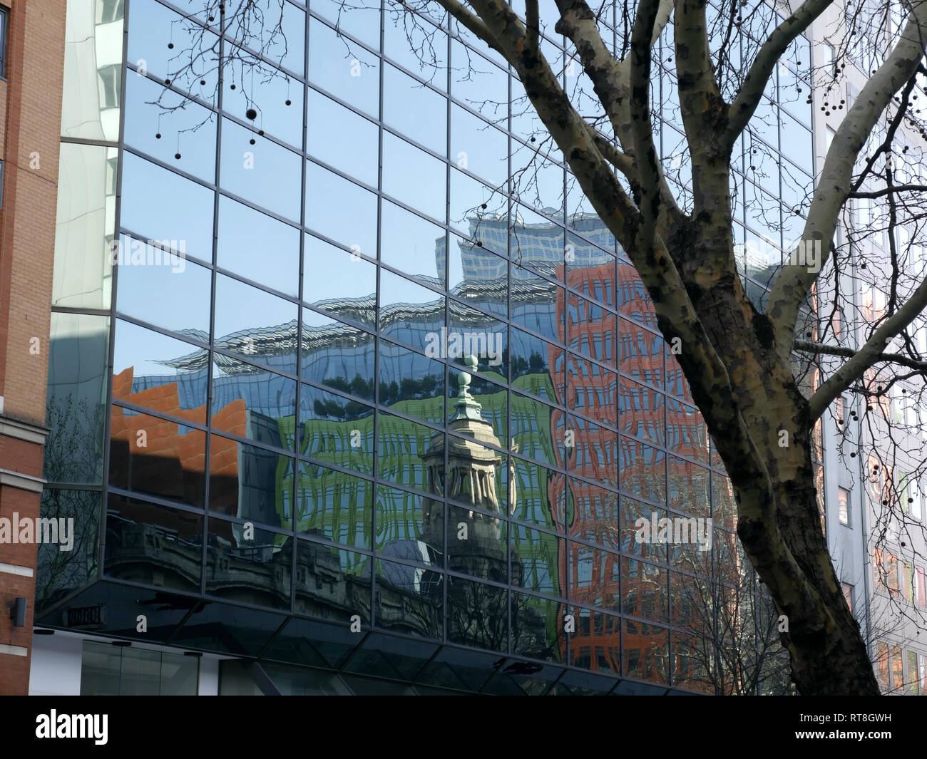 Reflections of the bell tower of the Shaftsbury Theatre and surrounding buildings. Stock Photo