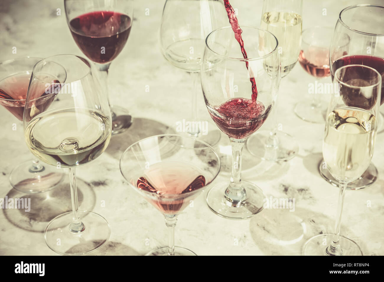 Wine tasting concept - glass with different wine on marble background Stock Photo