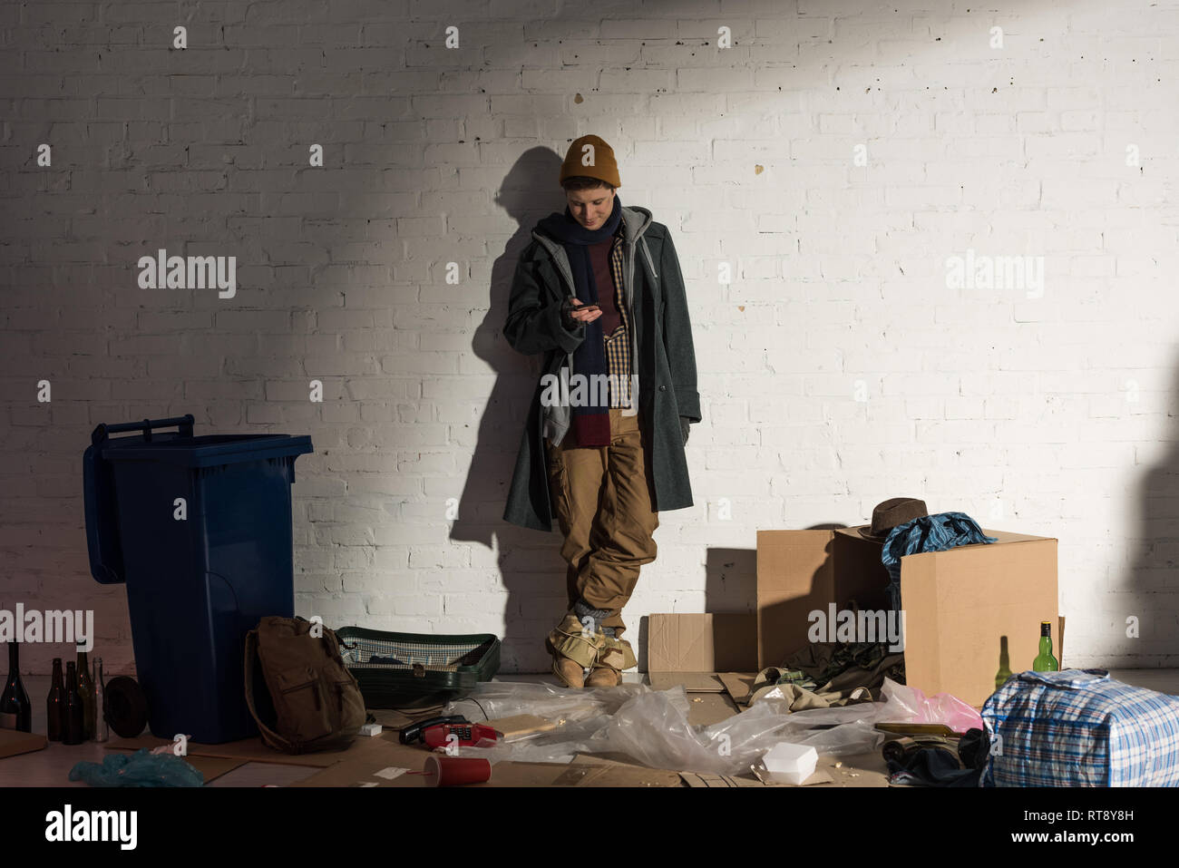Homeless man standing on street hi-res stock photography and images - Alamy