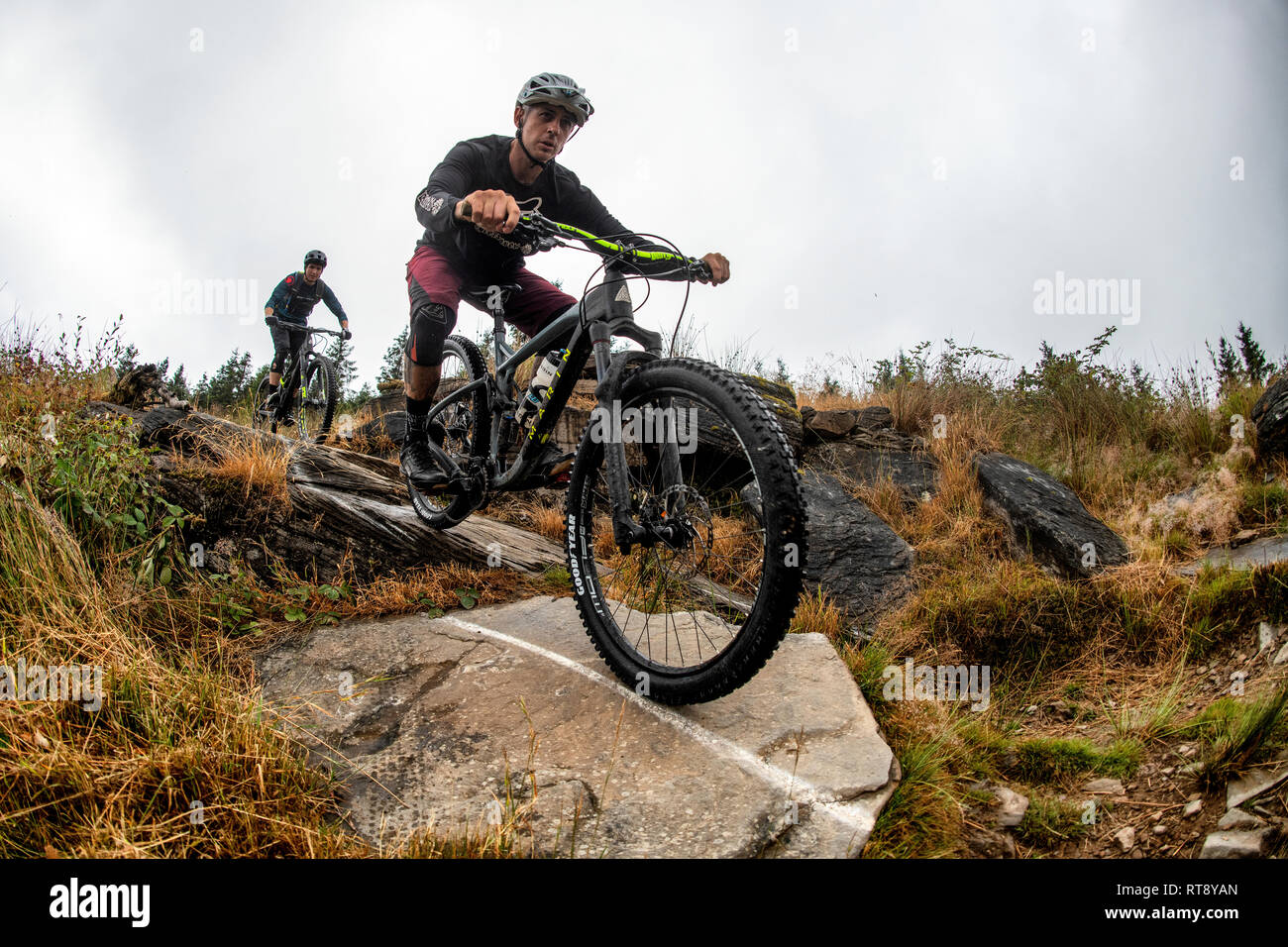 Two men ride mountain bikes on a trail at Glyncorrwg in Neath Port