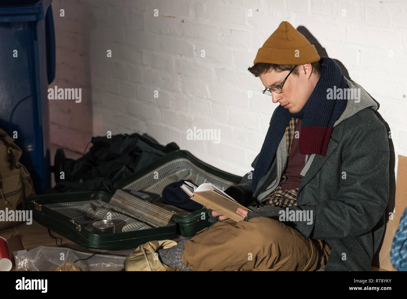 Homeless man reading book in hires stock photography and images Alamy
