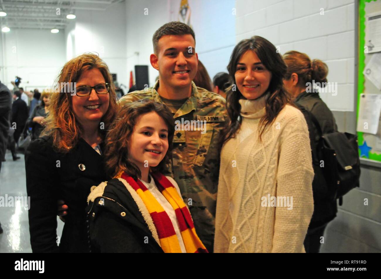 Spc. Alexander Gordon poses for a group photo with his family at the  farewell ceremony. New Jersey National Guardsmen from Headquarters and  Headquarters Company, 2nd Battalion, 113th Infantry Regiment said farewell  to